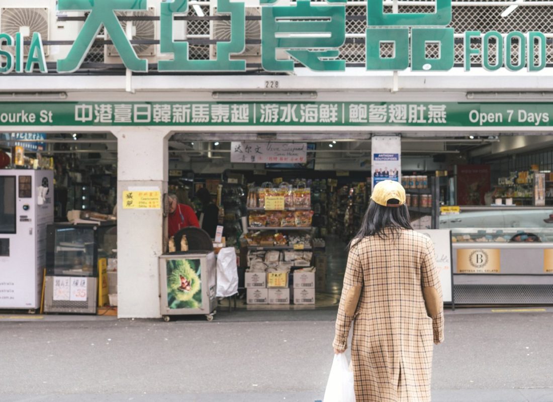 Shopper outside an Asian grocery store on Little Bourke Street, Melbourne Chinatown