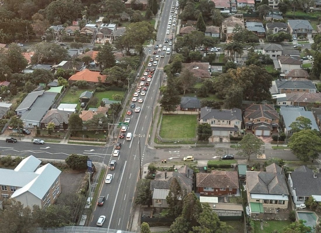 Aerial view of an Australian suburb at dusk looking toward the city
