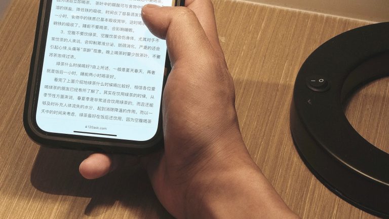 Person reading messages on a smartphone