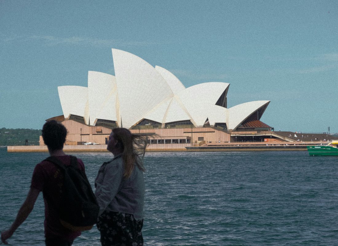 Visitors looking across the harbour at the Sydney Opera House