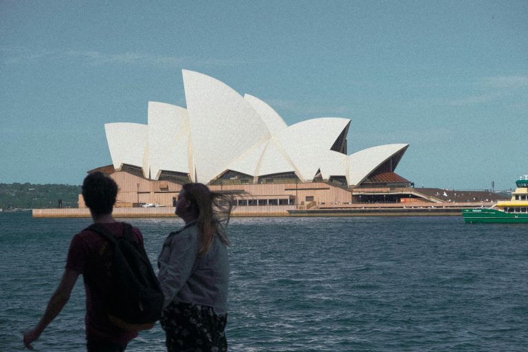 Visitors looking across the harbour at the Sydney Opera House